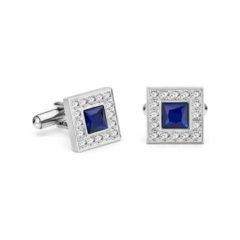 Pair of square cufflinks with blue gemstones and silver borders on a white background
